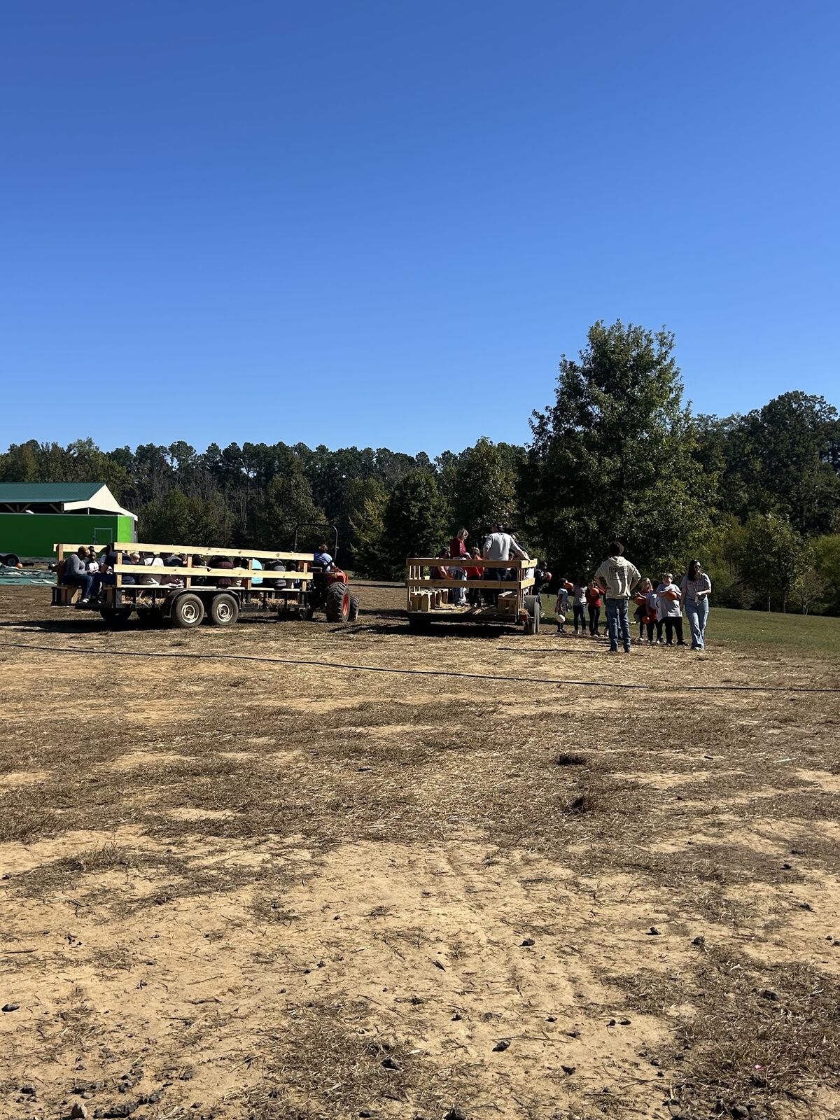 Hayride wagons parked in an open lot